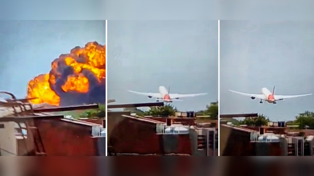 Air India A-171 crash site in Ahmedabad showing burning wreckage and rescue teams working in a residential area.
